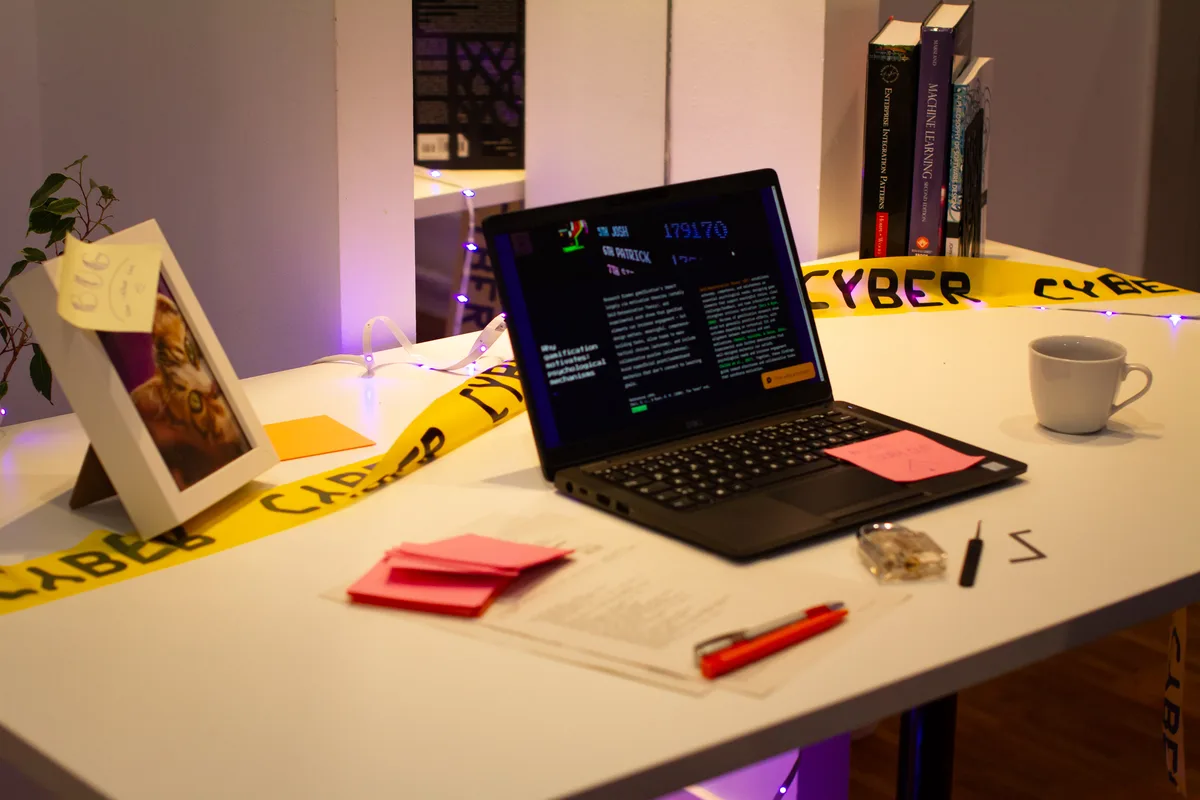 SecuriQuest escape game room setup with props and CYBER tape